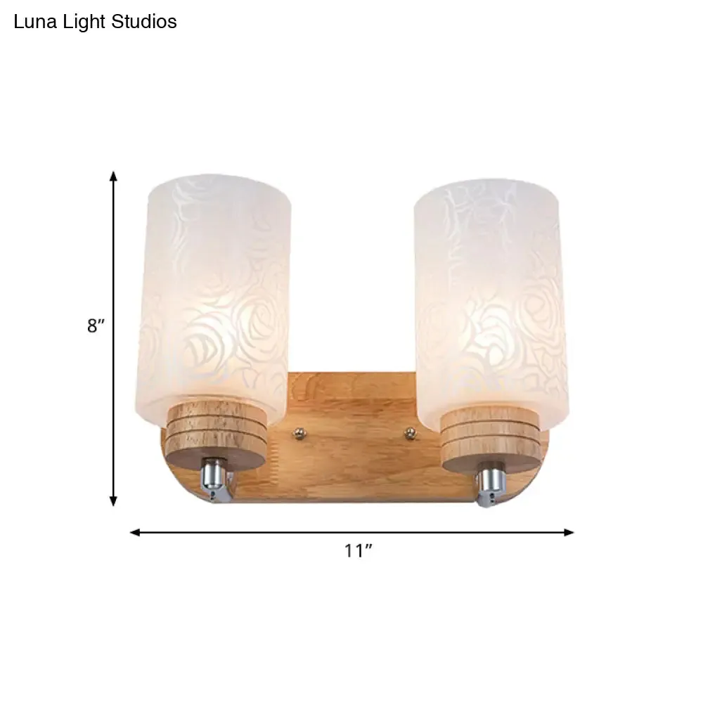 Modern 2-headed White Glass Cylinder Wall Sconce with Wood Wall Mount and Rose Pattern